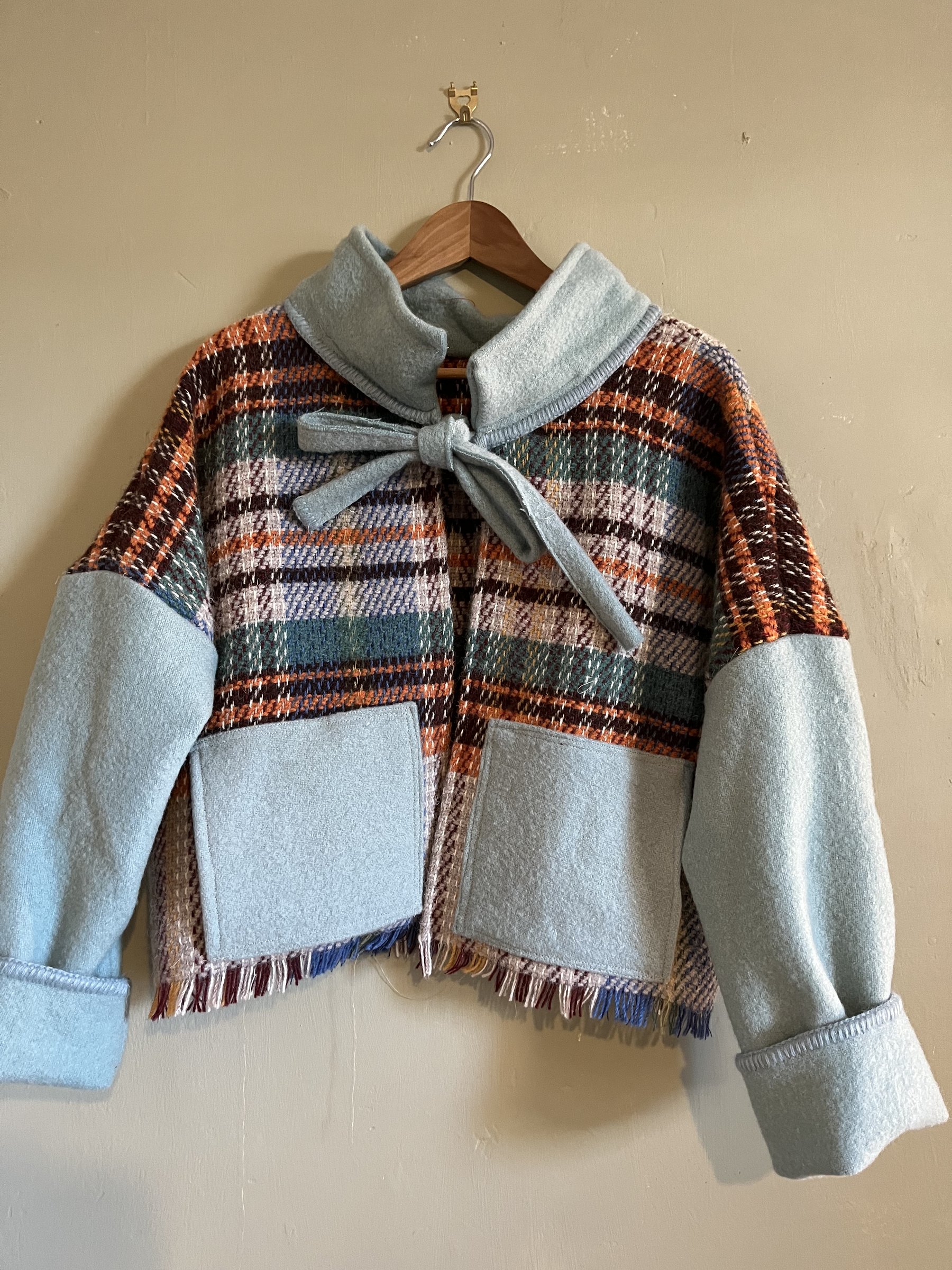 Tartan check and baby blue woolen jacket.